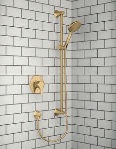 an image of a shower head and handset in a bathroom setting with white subway wall tiles