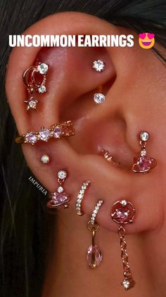 an ear with several different types of piercings on it and the words aesthetic earrings written in