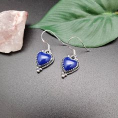 Visit our on-line shop at: Etsy.com/shop/AlbuquerqueDesigns *sterling silver earrings *dangles / drops / ear wires / hooks *southwestern jewelry *blue lapis lazuli *calibrated pre-cut stones: 10x10mm heart shape *back of jewelry items are all covered / do not show the back of stones *all jewelry items are made to ship, slight variations in stones will occur comparing to pictures. *size of a penny is 19mm or a dime is 18mm in diameter for comparing size with jewelry items. *handcrafted in USA *fr Lapis Jewelry, Lapis Earrings, Lapis Necklace, Carnelian Necklace, Blue Pendant, Jewelry Blue, Southwestern Jewelry, Teardrop Necklace, Blue Lapis