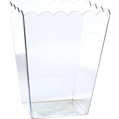 a clear plastic vase with scalloped edges