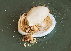 a plate with some kind of food on it that is covered in icing and crumbs