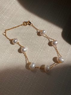 Delicate Gold Chain Bracelet With Pearls, Dainty Gold Pearl Bracelet With Pearl Charm, Gold Bracelets With Pearl Drop In 14k Gold Filled, Classic Gold Bracelet With Pearl Drop, 14k Gold-filled Bracelets With Pearl Drop, Elegant Baroque Pearl Bracelet With Pearl Charm, Delicate Handmade Pearl Bracelets, Rose Gold Pearl Bracelets With Pearl Chain, Elegant Pearl Drop Chain Bracelet Gift