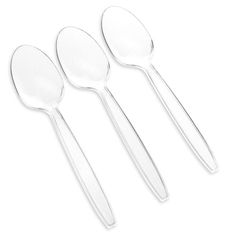 three clear plastic spoons on a white background