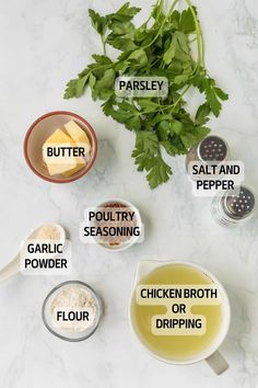 ingredients for chicken broth laid out on a marble counter top with parsley, butter, garlic, salt and pepper