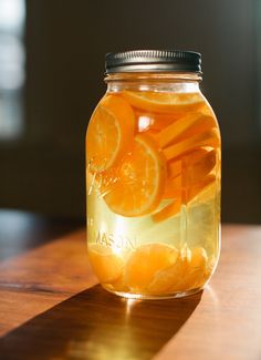 a mason jar filled with orange slices