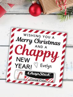 merry christmas and a happy new year sticker on a white wooden background with presents