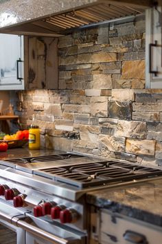 a kitchen with an oven, stove and counter top that has various fruits on it