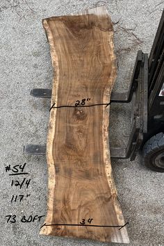 a piece of wood with measurements on it