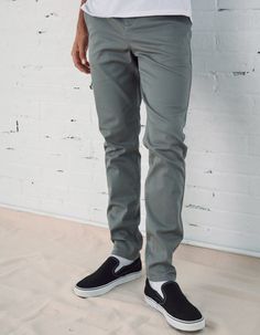 RSQ Skinny Chinos. Formerly known as the "Seattle Skinny Taper Chino Pants". Slant front pockets with welt back pockets and additional decorative pocket with RSQ tag at back left pocket. Approx leg opening: 13.5"(34cm). 97% cotton/3% spandex. Machine wash. Imported.Model is 6'2.5" wearing a size 31x32.Approx outseam: 41"Approx leg opening: 13.5" Casual Fitted Straight Work Pants, Casual Full Length Buttoned Pants, Casual Full Length Pants With Buttons, Fitted Casual Work Pants, Casual Slim Fit Trousers, Casual Pants With Button Zip Fly, Casual Slim Fit Gray Bottoms, Casual Full-length Pants With Button Zip Fly, Casual Fitted Pants With Buttons