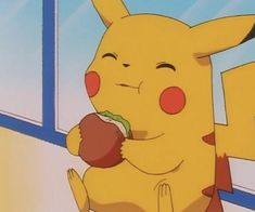 pikachu eating an apple in front of a window