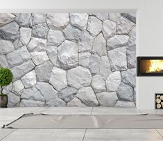 there is a fireplace in the middle of a room with stone walls and flooring