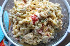 a bowl filled with macaroni salad on top of a table