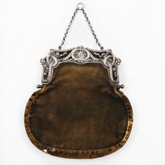 A Victorian Chatelaine Purse With A 900 Silver Frame. The Silver Frame Is Modeled With Reticulated Laurel Swag, Floral Accents And A Lyre To The Center. The Body Of The Bag Is Green Velvet With One Divided Pouch To The Interior. Dimensions 7.25" W X 7.5" H X 0.75" D Victorian Bag, Victorian Chatelaine, Victorian Purses, Interior Dimensions, Chatelaine, Bits And Bobs, Green Velvet, Silver Frame, Mini Bag