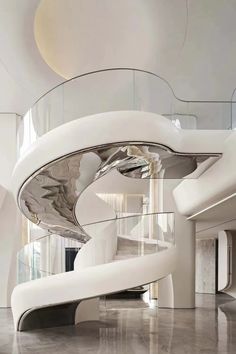 a white spiral staircase in a modern building