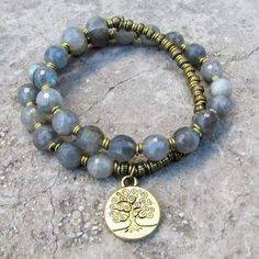 27 bead mala bracelet, made with genuine labradorite, hand made brass African Trade Beads (for sizing) and a tree of life charm. It wraps as a bracelet, (stringed on thick hi-tec elastic). Great on men and women alike! You may ask to have the charms removed, just add a note upon checkout. Labrodite is for strengthening intuitions, stimulating imagination, developing enthusiasm, create new ideas and goals, and helps to relief from depression. It is also said to bring good luck in the form of thin Personal Aesthetic, Labradorite Bracelet, Mala Bracelet, Homemade Jewelry, Beaded Wraps, Bijoux Diy, Diy Bracelets, Beautiful Bracelet, Wire Jewelry