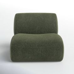 a green chair sitting on top of a white floor