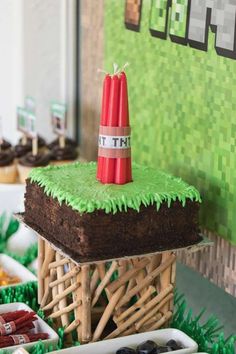 there is a cake on top of a table with other desserts in the background