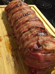 a large piece of meat sitting on top of a cutting board