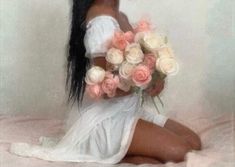 a woman with long black hair and white dress is holding flowers in her hands while sitting on a bed