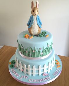 a birthday cake with a rabbit on top