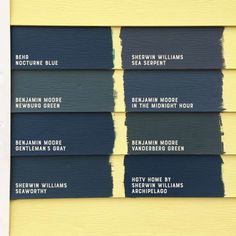 four different shades of paint on the side of a yellow building with white lettering that says,