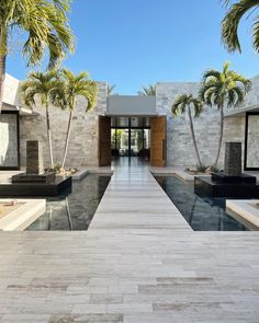 a modern house with pool and palm trees