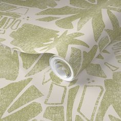 a green and white wallpaper with an abstract design on the bottom half of it