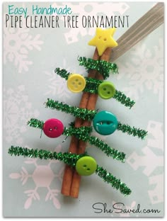 an easy homemade pipe cleaner tree ornament made out of cinnamon sticks and buttons