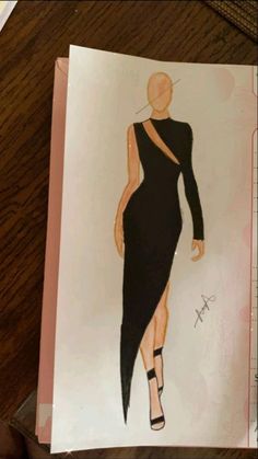 a drawing of a woman in a black dress on top of a piece of paper