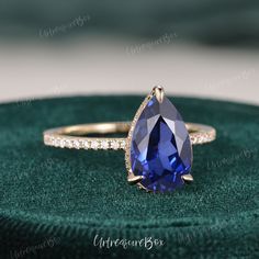 Pear Shaped Sapphire Engagement Ring Women Yellow Gold Hidden Halo Engagement Ring Pear Sapphire Ring Classic Ring Solitaire Promise Ring * Order Service: Engraving/Rush Order/ Shipping Upgrade/ Size Upgrade/ 18K or Platinum upgrade https://www.etsy.com/listing/889751602/ Jewelry Details: * Center Stone: Lab Sapphire ,  Pear Shaped * Measures: about 2.5ct, 7*11mm as shown * Select when you checkout * Accents: 0.21 ct moissanite * Metal Type: Solid 14k yellow gold, rose gold, white gold (Platinum Sapphire Teardrop Ring, Blue Pear Engagement Ring, Pear Shaped Sapphire Ring, Pear Sapphire Engagement Ring, Sapphire Pear Engagement Ring, Gold Hidden Halo Engagement Ring, Sapphire Engagement Ring Pear, Pear Cut Sapphire Ring, Pear Sapphire Ring