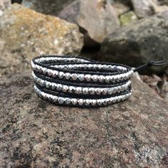 "This triple wrap beaded bracelet will look great with your favorite pair of jeans or your little black dress. Made with black leather cord, 4mm faceted silver Czech glass beads. It will fit a 6 1/2\"- 7 1/2\" wrist. You can send me your wrist measurement for a custom order at no extra charge." Wrap Bracelet With Faceted Beads For Festivals, Faceted Beads Wrap Bracelet For Festivals, Wrap Bracelet With Faceted Round Beads For Festival, Adjustable Wrap Bracelet With Black Round Beads, Adjustable Wrap Bracelet With Black Beads, Adjustable Black Beads Wrap Bracelet, Adjustable Silver Leather Bracelet Hand Wrapped, Adjustable Hand Wrapped Silver Leather Bracelet, Bohemian Silver Wrap Bracelet With Faceted Beads