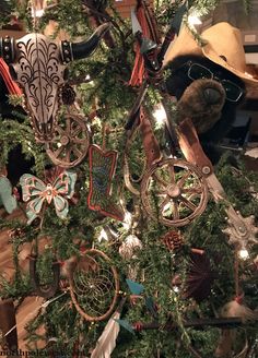 a christmas tree decorated with many different ornaments and hats on it's headbands