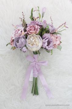 a bouquet of flowers on a white furnishing