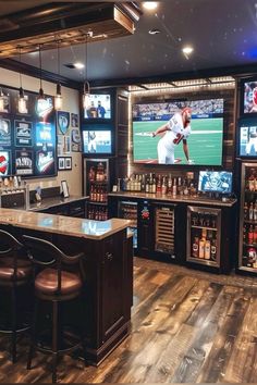 a sports bar with several televisions on the wall