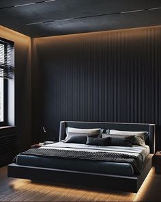 a large bed sitting in the middle of a bedroom next to a window with blinds on it