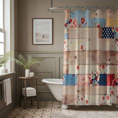 a bath room with a tub and a shower curtain