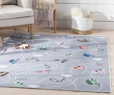 a child's rug with cars and trucks on it