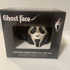 a black and white mask in a box