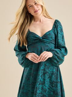 This dress features a flattering square neckline, balloon sleeves, and a knotted bodice for a touch of elegance. The has back with an adjustable bow, while the satin fabric ensures a luxurious feel. Highschool Dance, Bow Mini Dress, Bell Sleeve Dress, Altar'd State, Square Necklines, Christmas Dress, Balloon Sleeves, Christmas Sweatshirts, Square Neckline