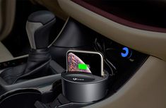 an iphone in the center of a car with a charger on it's side