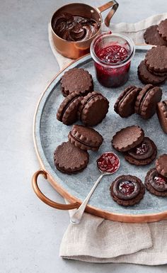 chocolate cookies and jam on a plate