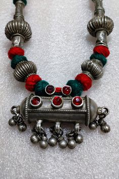 Handmade Vintage Rare Real Old High Grade Silver Beads Dangle  Ethnic Tribal Banjara Adjustable Cotton Thread Necklace Rajasthan Tribal Banjara Jewelery 26 inches longer Adjustable New cotton Threaded Necklace. Made By someone else. Discovered and collect by me from a small tribal banjara village of Rajasthan. Primary Color of Necklace is vintage Silver, Pre- Owned, Old looks. Weight of Necklace is 60.5.gms Pendant Width is 6.5cm Pendant Height of is 3.5cm It's a totally Handmade vintage tribal Red Traditional Temple Necklace With Latkans, Traditional Red Temple Necklace With Latkans, Heavy Bohemian Kundan Necklace For Celebration, Bohemian Heavy Kundan Necklace For Celebration, Traditional Necklaces For Festive Ceremonies, Traditional Red Necklaces With Motifs, Traditional Temple Necklace With Tilla For Festival, Bohemian Style Kundan Necklace With Cutdana For Ceremonial Occasion, Traditional Silver Beaded Kundan Necklace