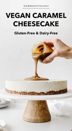 a person is pouring caramel cheesecake into a cake on a white plate with the title vegan caramel cheesecake gluten - free and dairy - free