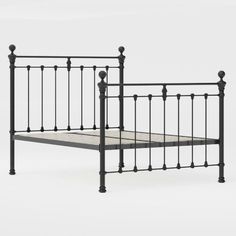 a metal bed frame with golden headboard and foot board on an isolated white background