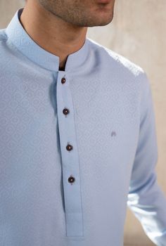 Color: Blue  Fabric: Organic Cotton  Includes:  -Kurta -Trouser -Kurta Trouser:  Breathable Soft Cotton with good fall.  -Mandarin collar  -Full Sleeves  -This is a 2 Piece Stitched Outfit Customize Stitching Available Traditional Blue Top For Eid, Long Sleeve Blue Tops For Eid, Traditional Long Sleeve Sets With Button Closure, Elegant Long Sleeve Light Blue Kurta, Blue Long Sleeve Kurta For Formal Occasions, Light Blue Long Sleeve Kurta With Dabka, Unstitched Traditional Blue Top, Formal Blue Long Sleeve Kurta, Light Blue Long Sleeve Dabka Kurta