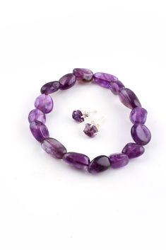 This Amethyst Tumbled Bead Bracelet Set is stretchy and fits most wrists. This bracelet is great worn alone and really comes to life when stacked with other bead or chain bracelets. It is so affordable you can collect several crystal bead bracelets featured on our site. Natural Amethyst Unpolished Stud Earrings are included. Wouldn't this bracelet set make a perfect gift? Amethyst is a type of purple quartz with an interesting history. The use of Amethyst can be traced as far back as 25,000 B.C. Crystal Bead Bracelets, Amethyst Tumbled, Purple Quartz, Silver Eagles, Chain Bracelets, Crystal Beads Bracelet, Interesting History, Bead Bracelets, Bead Bracelet