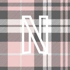 the letter n is made up of plaid fabric in pink and grey colors with white letters