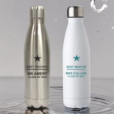 two stainless steel water bottles in the water