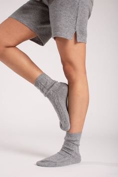 Meet the coziest shorts out there. With a mid-rise drawstring waist and sleek silhouette, these ultra-flattering, 100% cashmere shorts are the softest way to show some leg. Waffle-knit weave and we didn't forget the pockets. There are three total. – Loose, relaxed fit– Drawstring closure– Waffle knit– 100% CashmereSIZE & FITModel measurements: 5'6" tallModel is wearing US size Small Cozy Shorts With Soft Texture, Cozy Cable Knit Loungewear Bottoms, Cozy Cable Knit Bottoms For Loungewear, Cozy Knit Shorts, Cashmere Shorts, Cable Knit Socks, Cashmere Pants, Cashmere Socks, Soft Sock