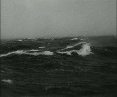 black and white photo of waves in the ocean